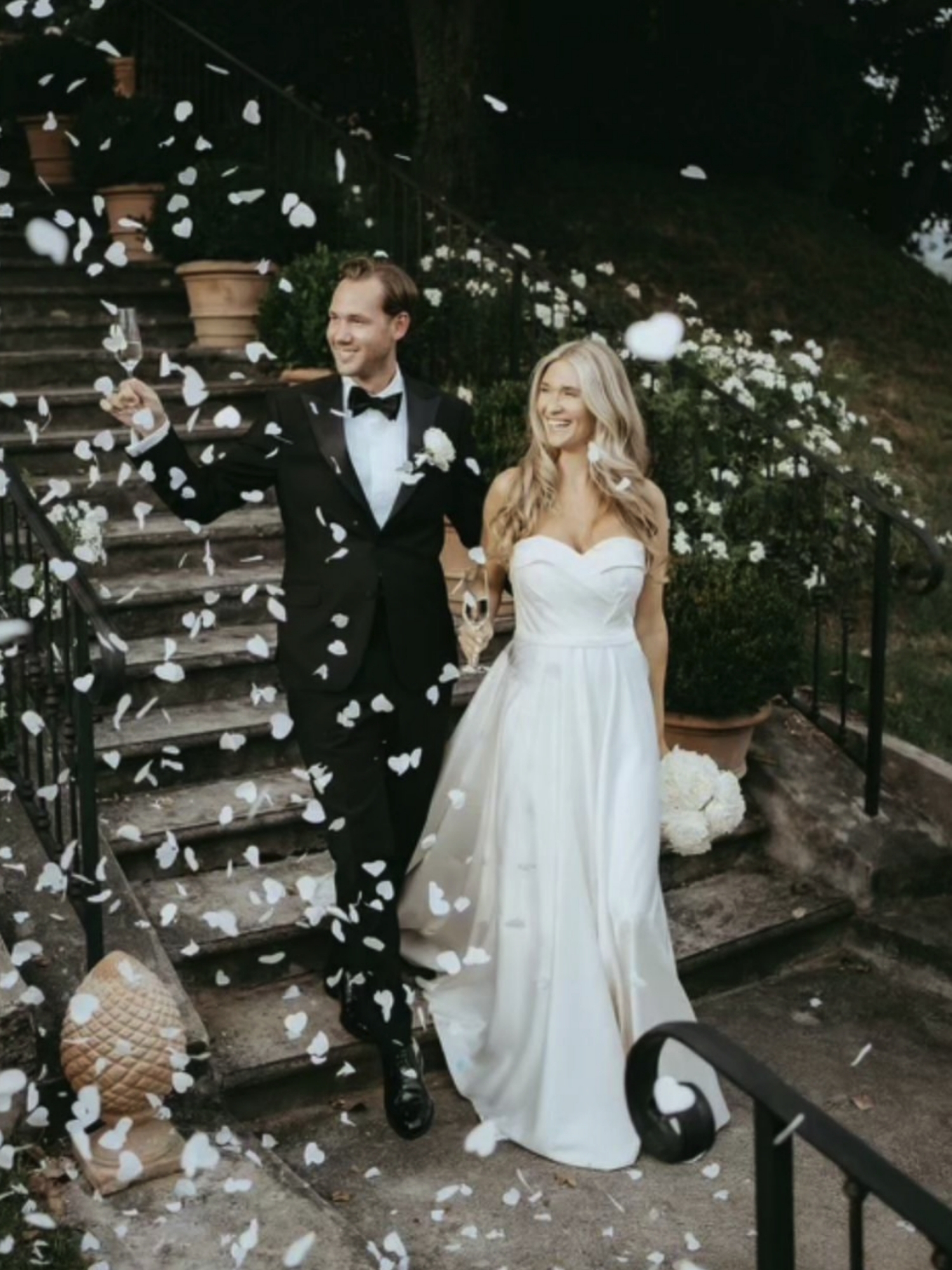 Wedding couple coming down the stairs